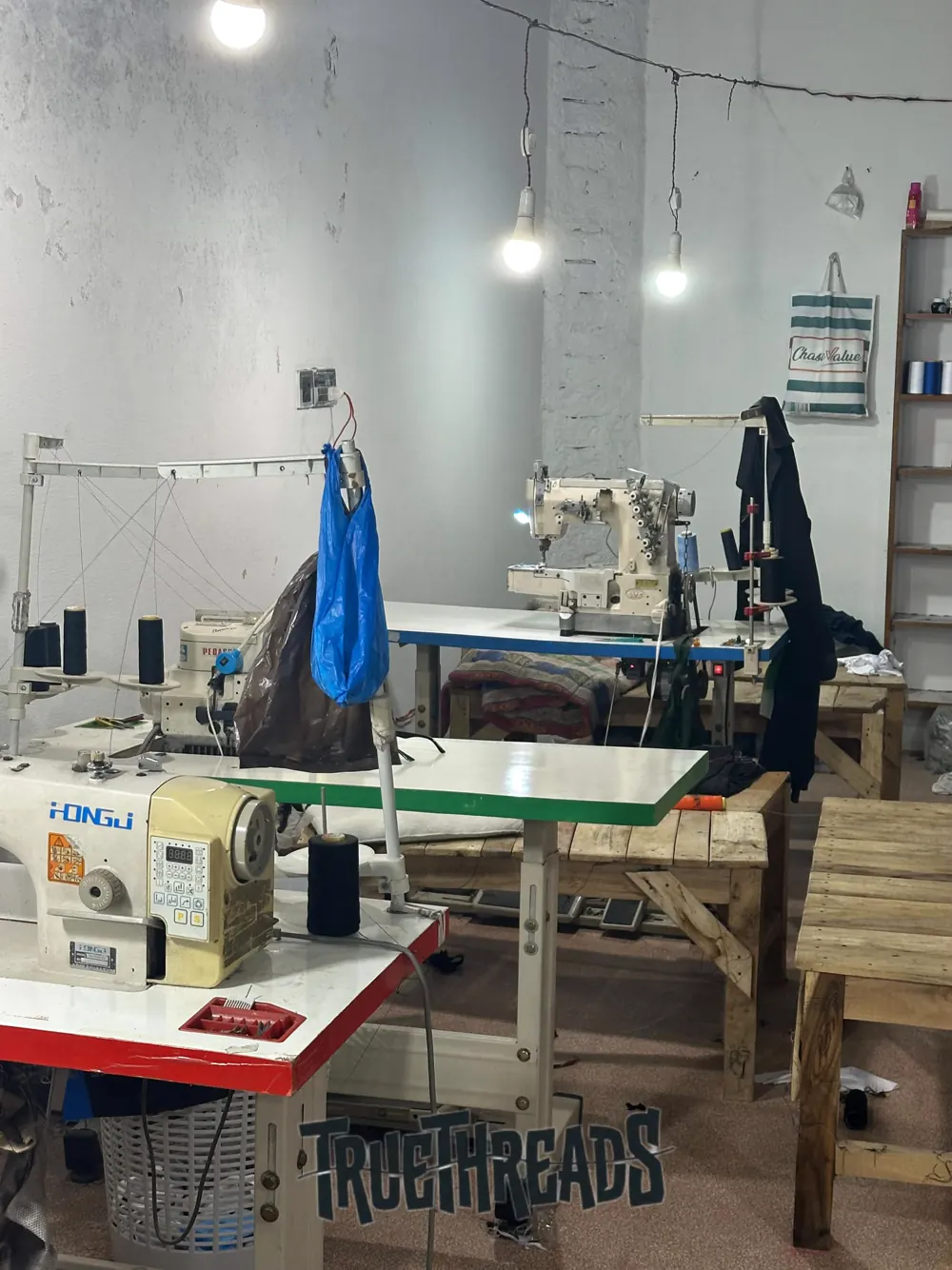 Main Assembly Floor — Active sewing lines & skilled artisan tailors